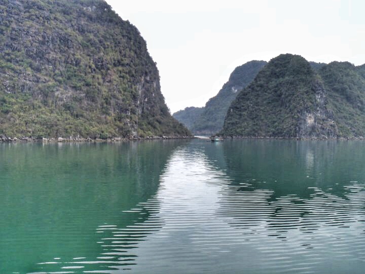 Even on a gloomy day, Ha Long Bay in Vietnam is beautiful.