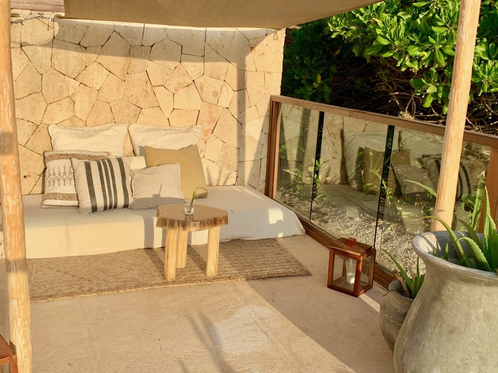 Enjoy your morning coffee or afternoon margarita at this quiet oasis at Tulum's Mezzanine Hotel.