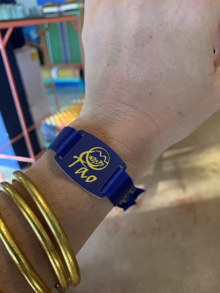 To pay for drinks on board Tao Expedition, you load money onto this band and tap.